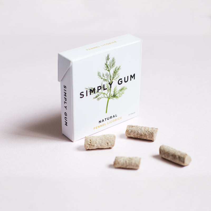 Pack of Fennel Gum on table with loose gum