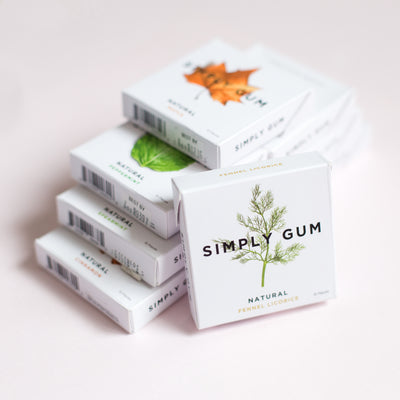 Stack of Gum on Table including Fennel, Maple, and Peppermint Chewing Gum